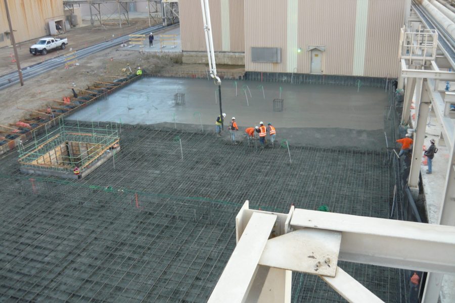Contractors Setting Cement Foundation
