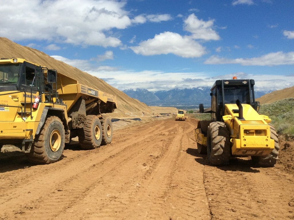 Various Construction Trucks Dirt Road
