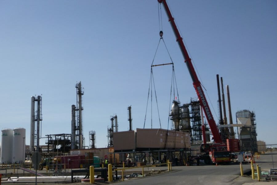 Crane Transporting Construction Materials | Oil & Gas Refinery Construction Projects | Wollam Construction