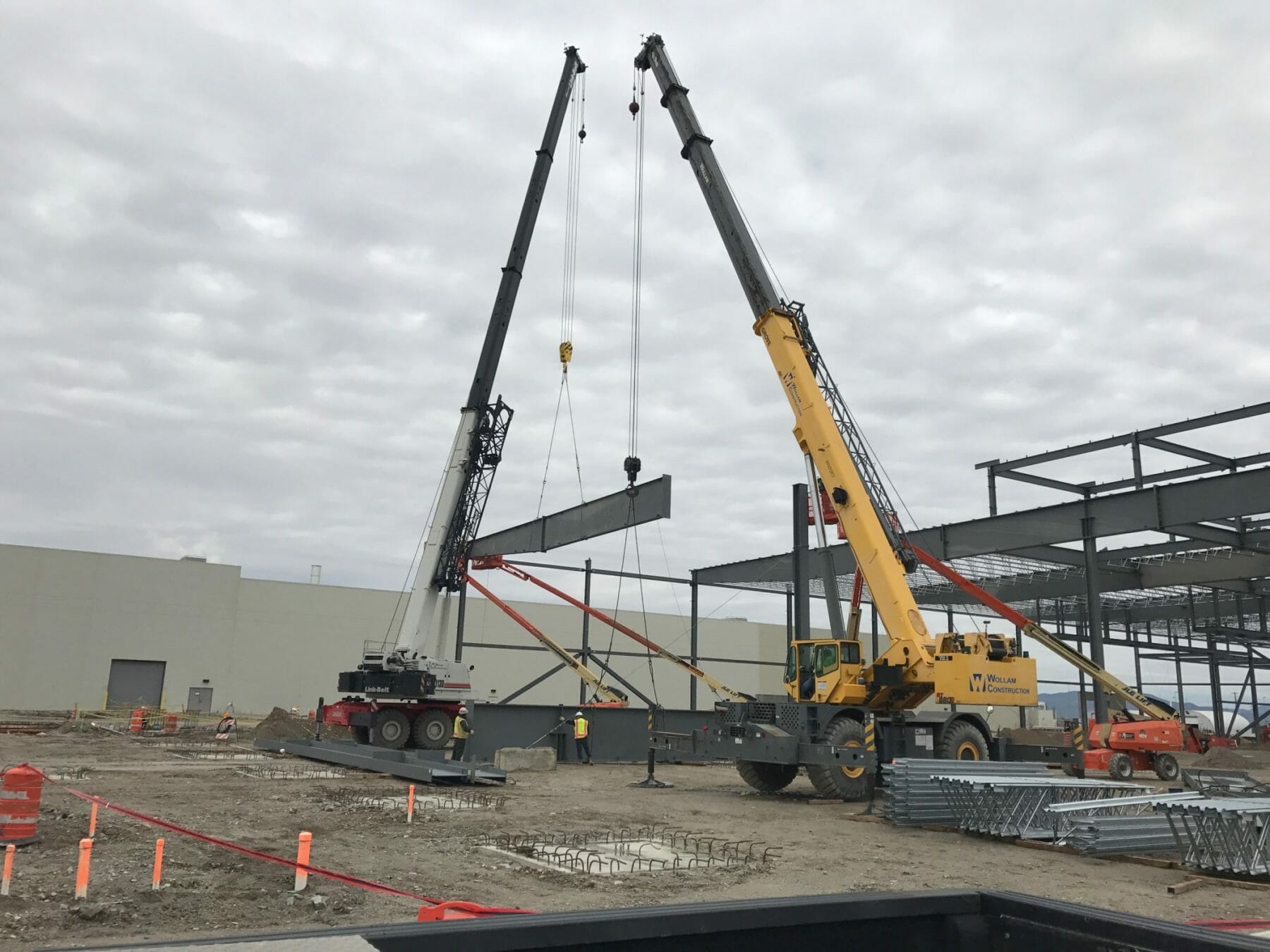 Cranes Setting Steel Wall Segments