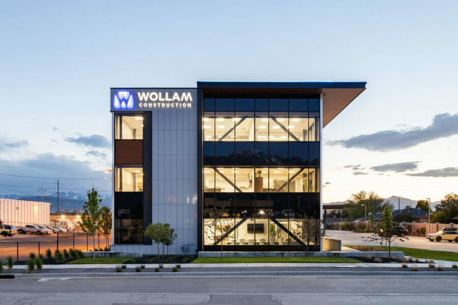 Wollam Construction headquarters office building exterior with lights